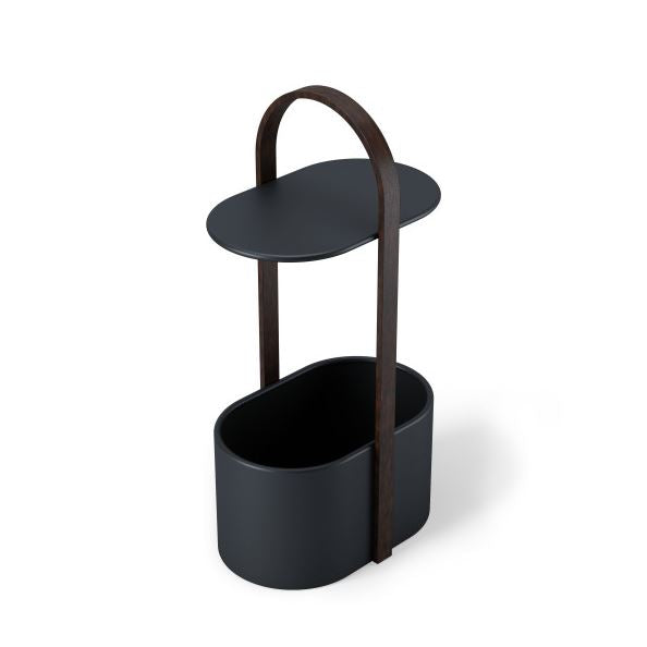 Umbra Bellwood storage table in black and walnut, angled view of the oval bin and arched handle