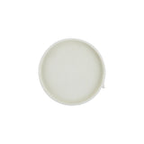 A Zakkia Burlap Round Tray - Small White on a white surface.