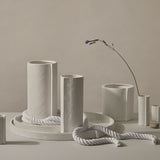 A group of Zakkia hand crafted ceramic vases with a minimalist design on a table.
