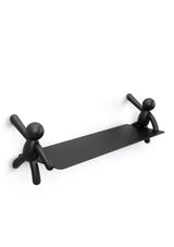 A playful design featuring a Buddy Shelf - Black / White from Umbra with two Buddy figures.