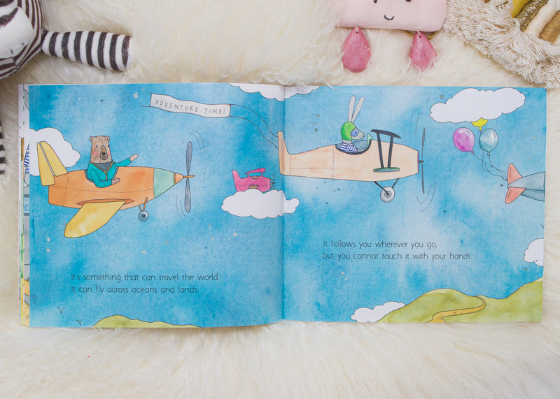 Spread from In a World Full of Magic showing a bear and a bunny flying planes through a blue sky