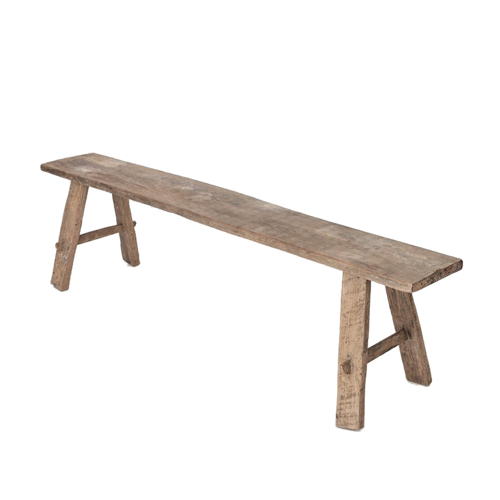 Teak long bench at an angle, the weathered plank top and A frame legs in view