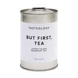 A tin of But First, Tea breakfast blend tea with the words "but first tea" on it.
