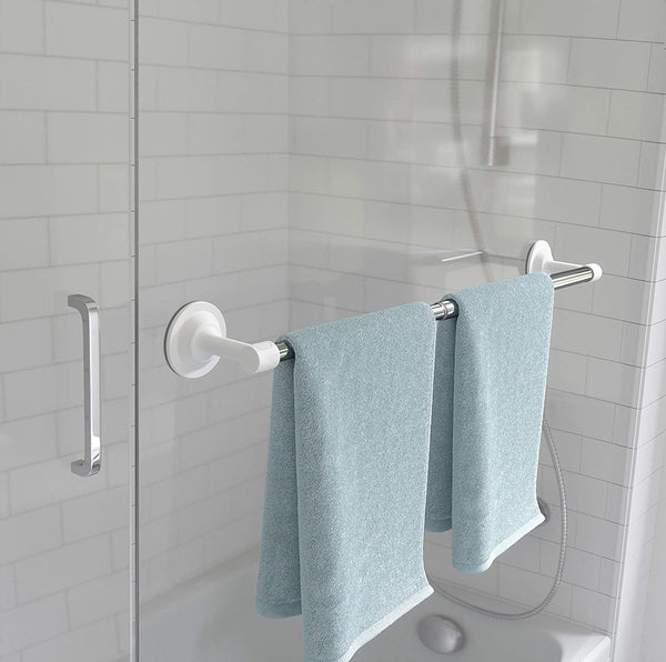 A bathroom with Umbra's Flex Sure-Lock Towel Bar Chrome technology holding two towels on a shower rod.