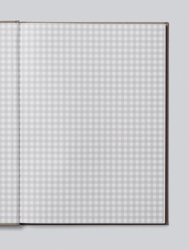 Write To Me Baby journal open to its grid-patterned endpapers