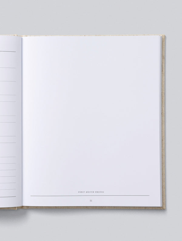 Open Write To Me Baby Journal showing a blank first month page
