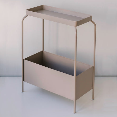 A small table with a tray on it, perfect as a Garcia Home Metal Planter Stand - Various Options or decorative accessory with a powder-coated finish.