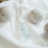 A set of Ecoya laundry dryer balls, perfect for home fragrance and gifting, placed on a white towel.