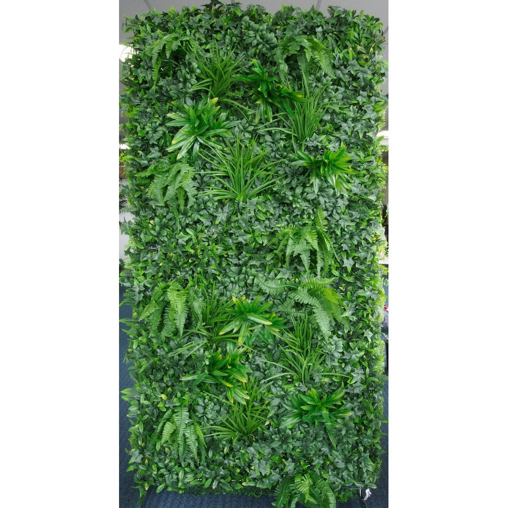 Artificial green wall panel styled as a backdrop in a modern living space