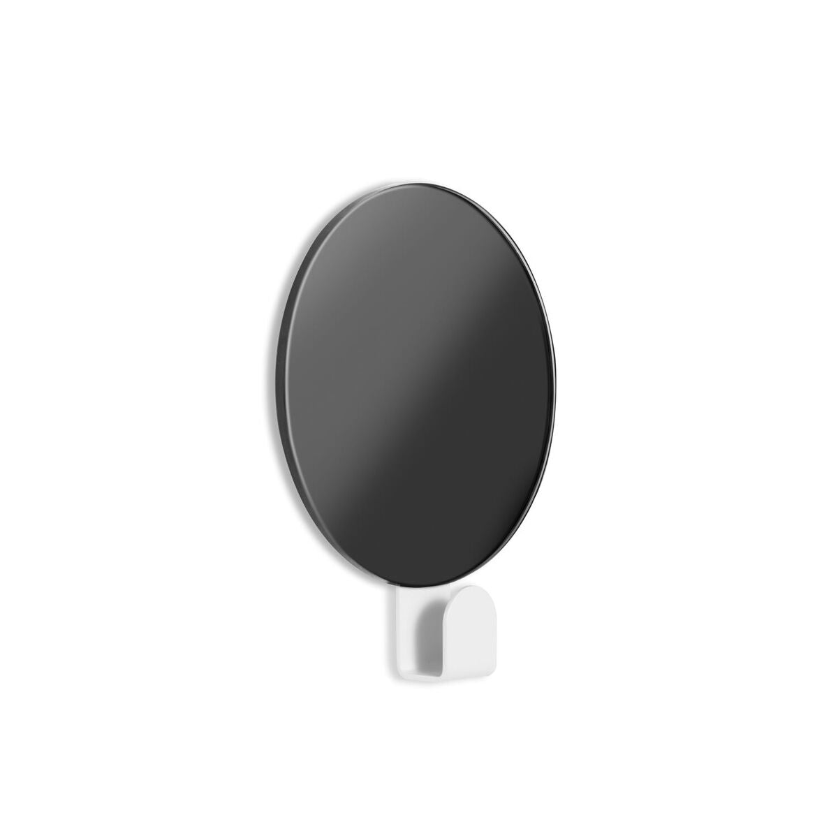 A FOLD Hook Mirror ∙ White hanging on a Made of Tomorrow surface like a coat hook.