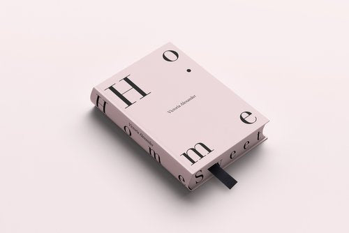 A pink box with the words "Home | Victoria Alexander" on it, featuring a stylish book design.