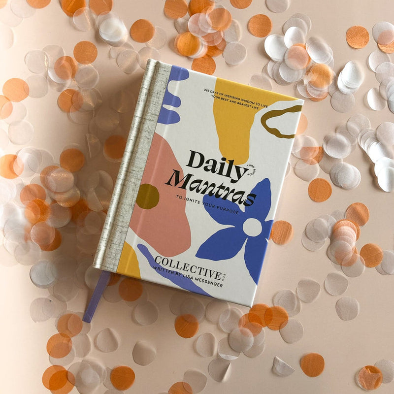 Collective Hub's book, "Daily Mantras to Ignite Your Purpose Version 3," filled with inspiring daily mantras and adorned with confetti.