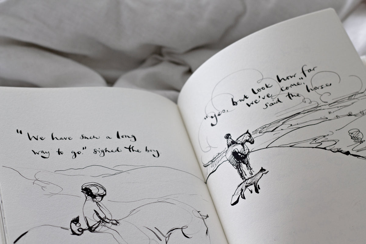 An open Charlie Mackesy | The Boy, The Mole, The Fox and The Horse book.