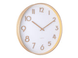 A Karlsson wall clock with gold numbers, showcasing pure design and Scandinavian influences.