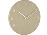 A round Karlsson Charm Wall Clock - Various Colours with engraved gold numbers on a white background.