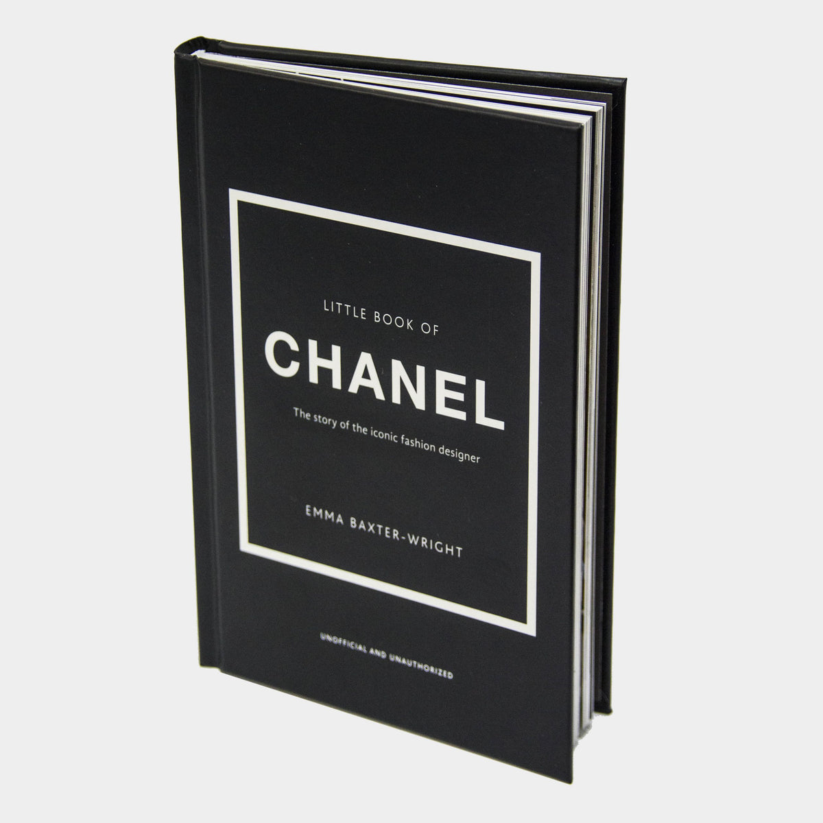 Angled view of the Little Book of Chanel hardcover on a grey background