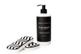 Barkly Basics Dish Detergent paired with eco-friendly black and white chevron sponges.