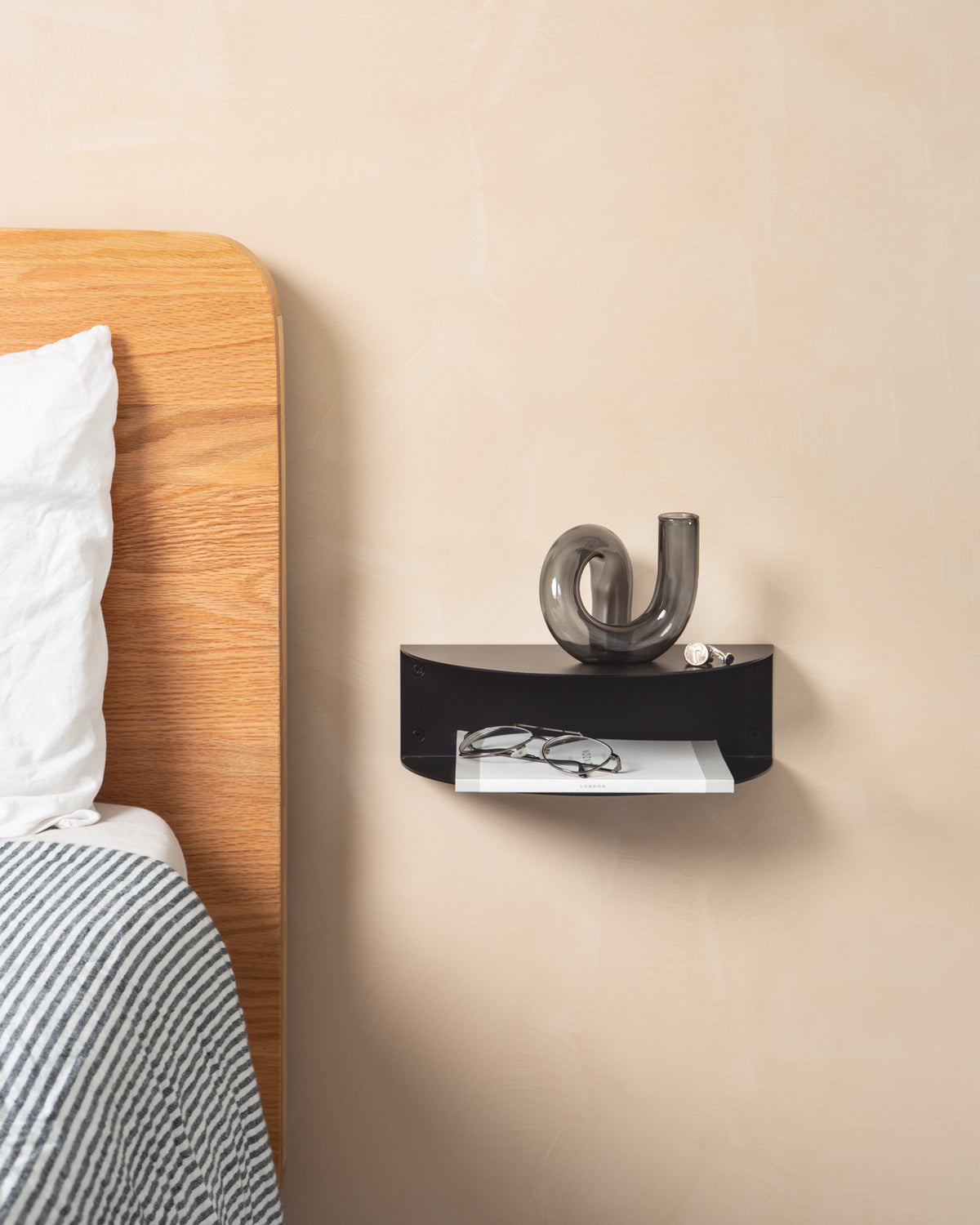 FOLD Bedside Table Mini in black mounted on a wall