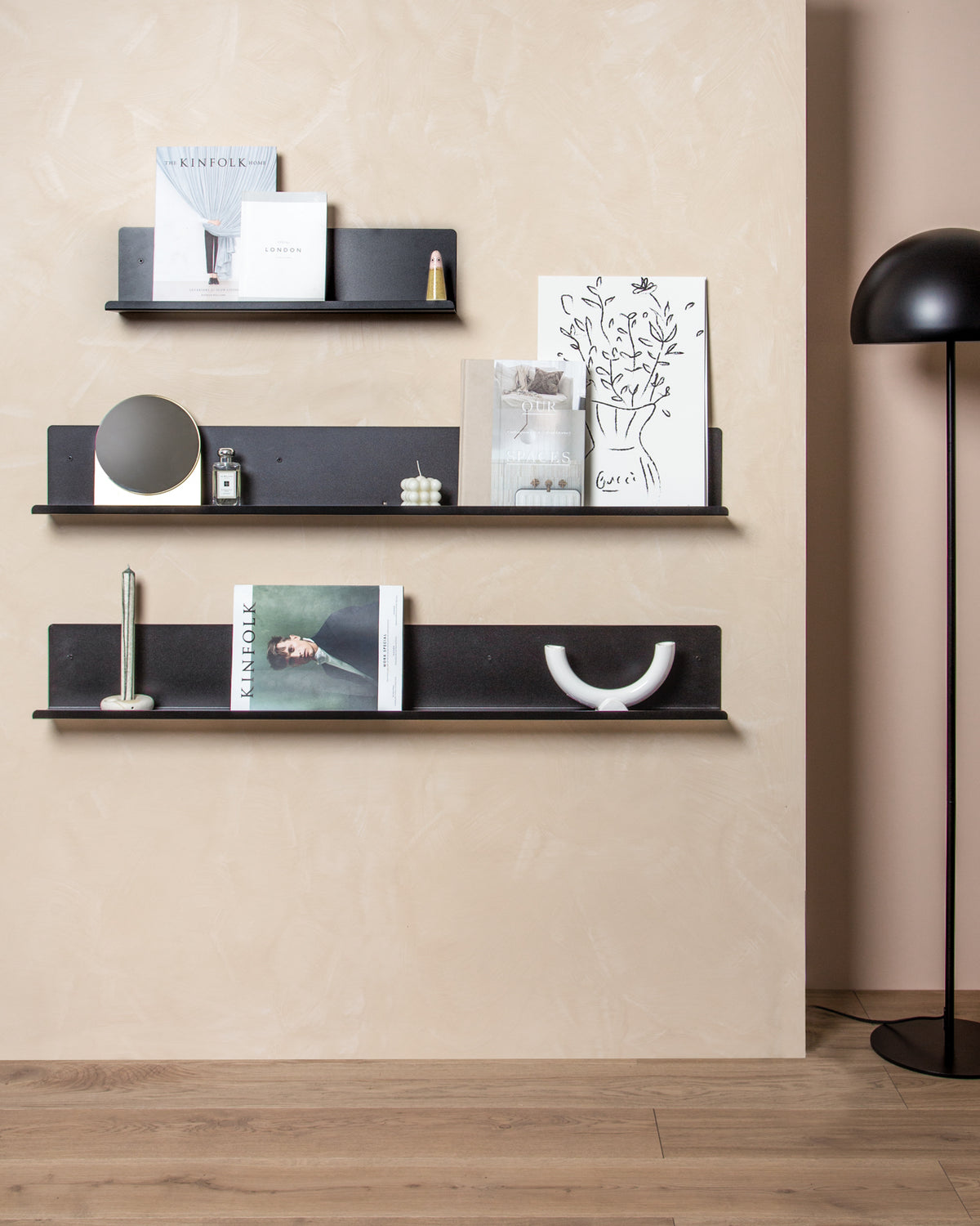 FOLD Display Ledge 600mm Black styled with a leaned art print