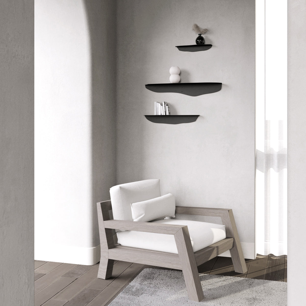 Three black wavy shelves in an arched plaster alcove above a pale timber armchair and woven rug