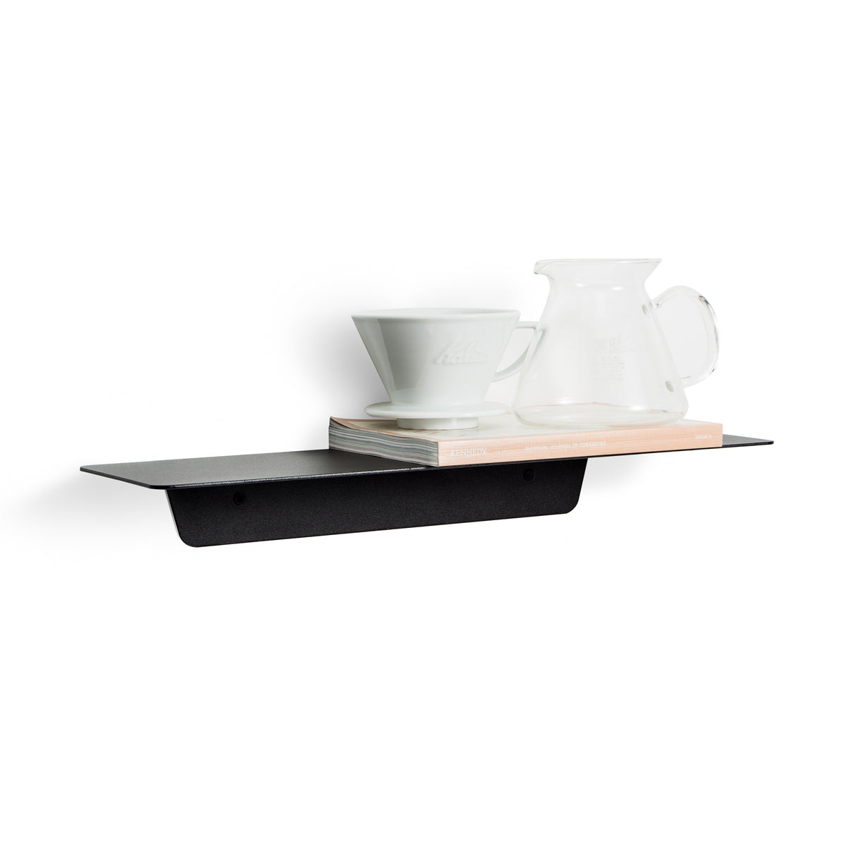 FOLD Ledge in black with a teacup, a glass jug and books