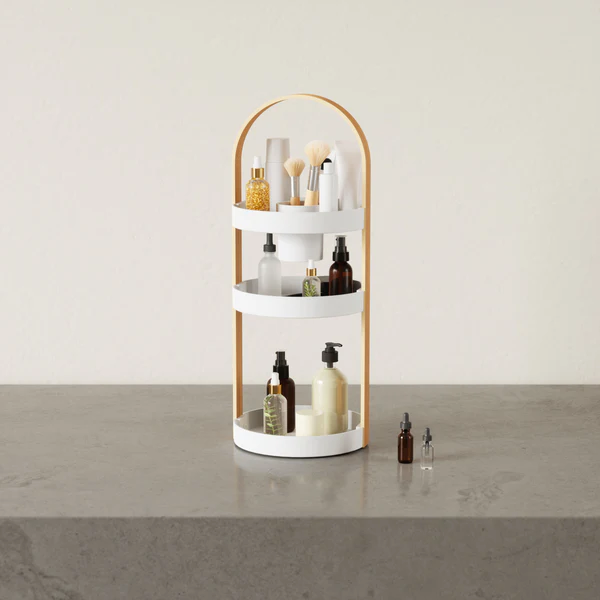 An Umbra BELLWOOD Cosmetic Organizer with cosmetics and lotions.