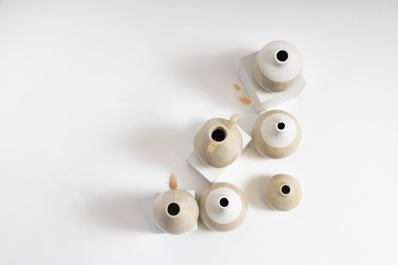 A collection of Charlie Vases from the Ned Collections on a white surface.