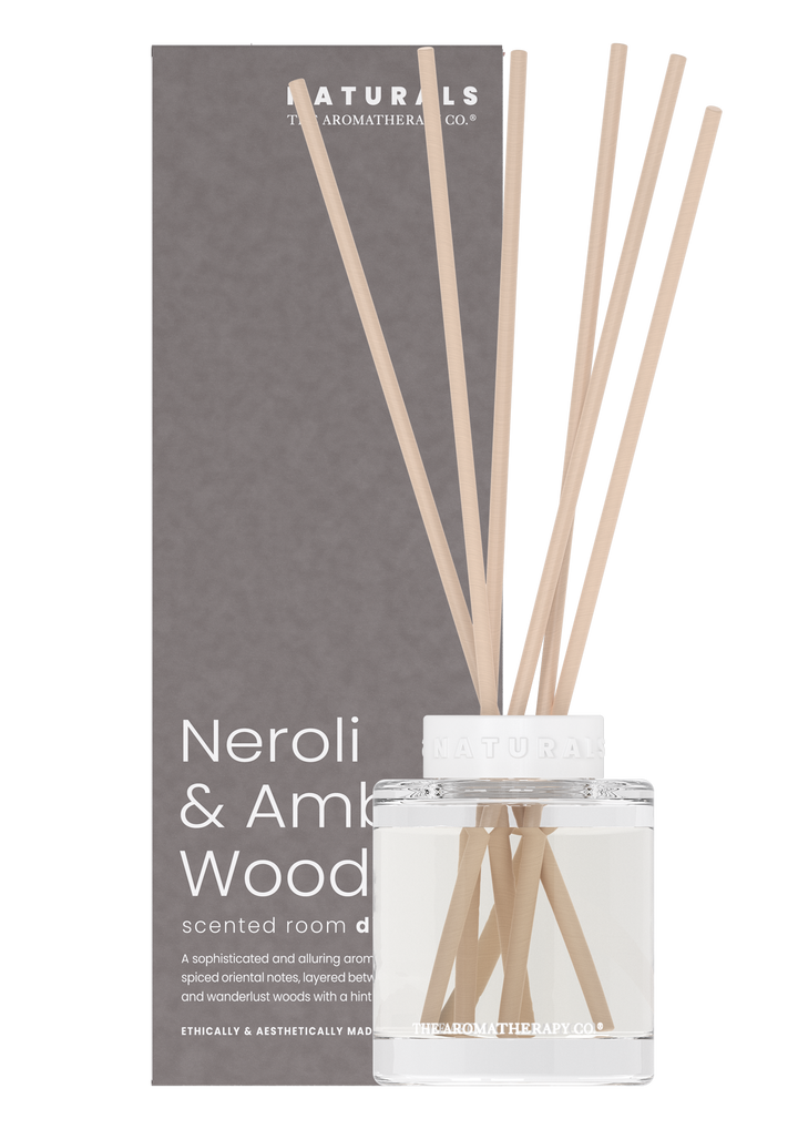 Naturals diffuser standing in front of its grey Neroli and Amber Wood box