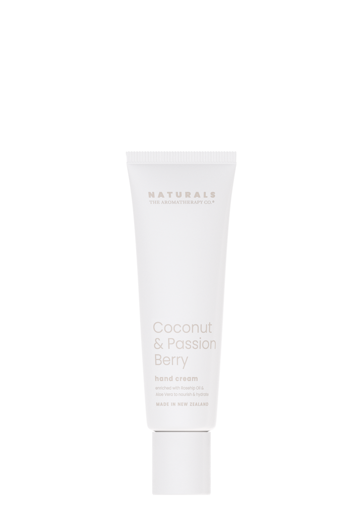 Naturals Coconut & Passion Berry hand cream in a white tube on a white background