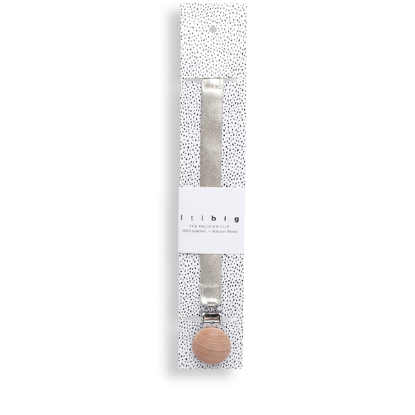A practical accessory, the LTL BIG | PACI CLIP IN GOLDIE is a wooden pacifier holder with a charming wooden ball attached to it.