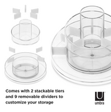 A set of Cascada cosmetic organizers in a plastic container with a rotating base by Umbra.