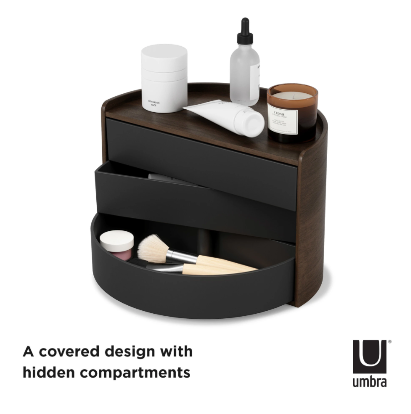Umbra Moona storage box in black and walnut with drawers open, skincare on the timber top