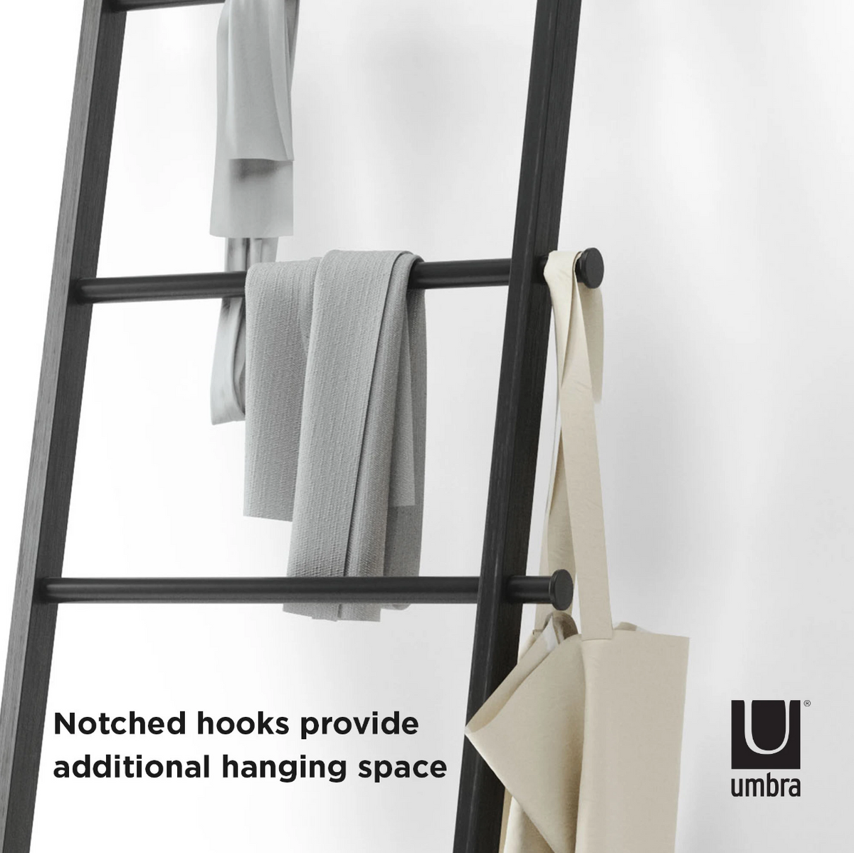 Umbra Leana black ladder holding hanging clothing