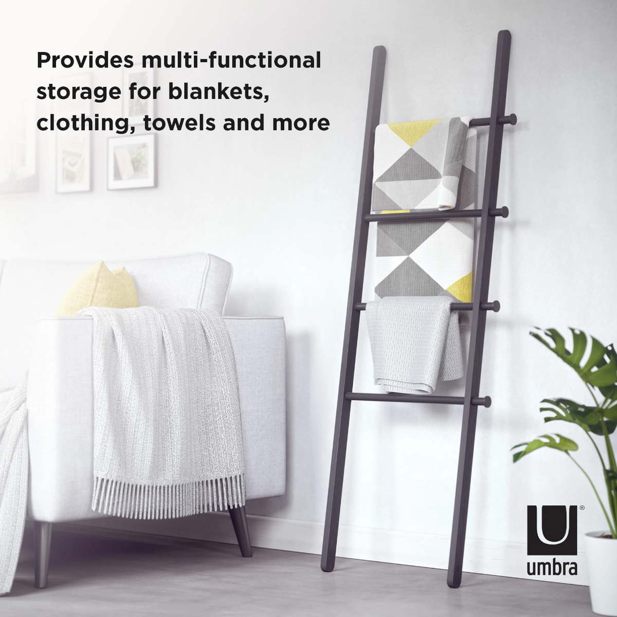 Umbra Leana black ladder holding towels and blankets