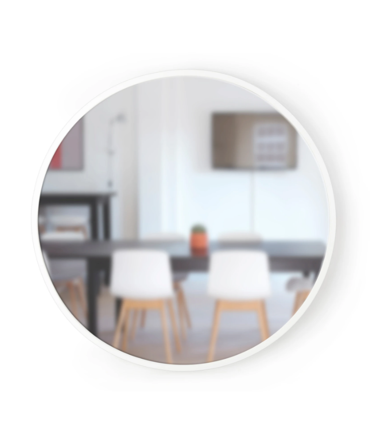 A durable HUB WALL MIRROR - White 94cm by Umbra with a versatile white table and chairs.