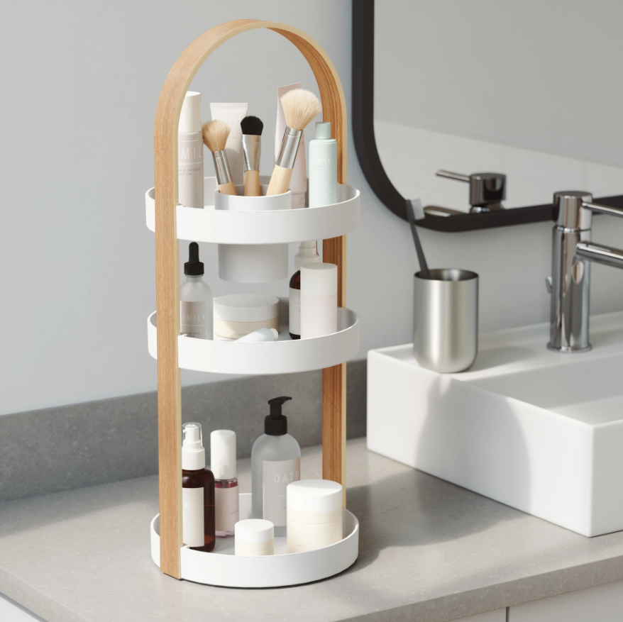 Umbra Bellwood cosmetic organiser holding brushes and skincare on a vanity