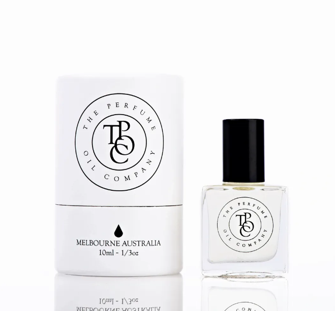 A beautiful gift: a bottle of BLONDE fragrance by The Perfume Oil Company, inspired by Bloom (Gucci) cologne, displayed next to a white box.