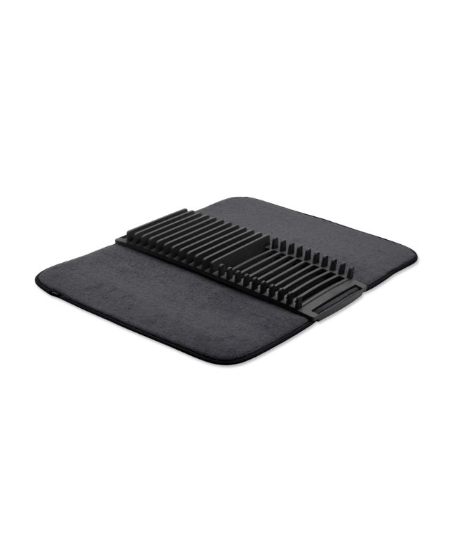 A black Umbra UDry drying mat on a white surface.