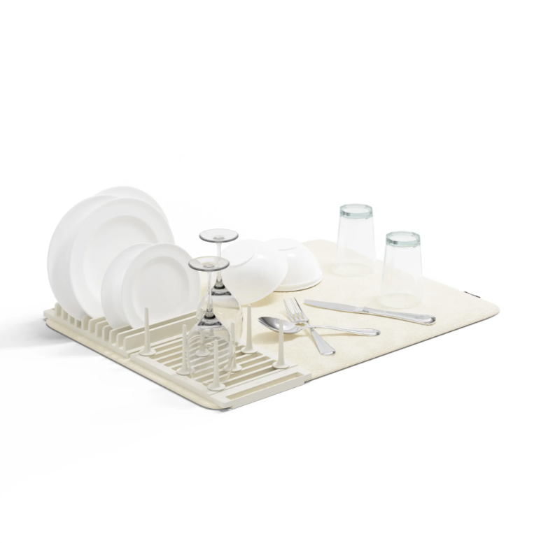 Umbra Udry peg drying rack with mat holding dishes and silverware