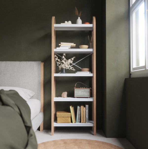 A Bellwood Five Tier Shelf in a bedroom with green walls, featuring an Umbra range.