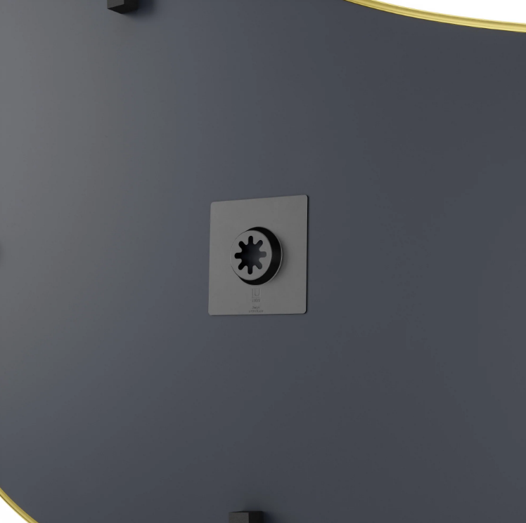 Rear keyhole mounting plate on the Umbra Hubba Pebble Mirror, allowing eight hanging orientations.