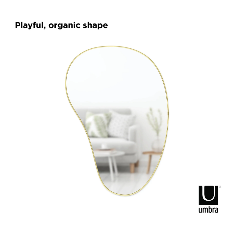 Umbra Hubba Pebble Mirror, an organic wall mirror with a soft irregular outline.