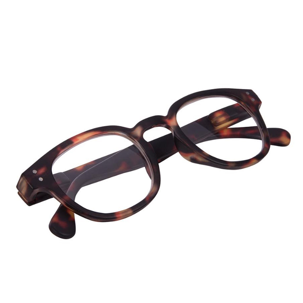 Blue light glasses with a tortoiseshell frame, folded, on white