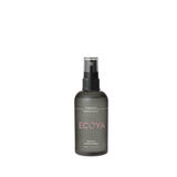 A bottle of Ecoya Fragranced Sanitiser Spray with exquisite home design, showcased on a sleek black background.