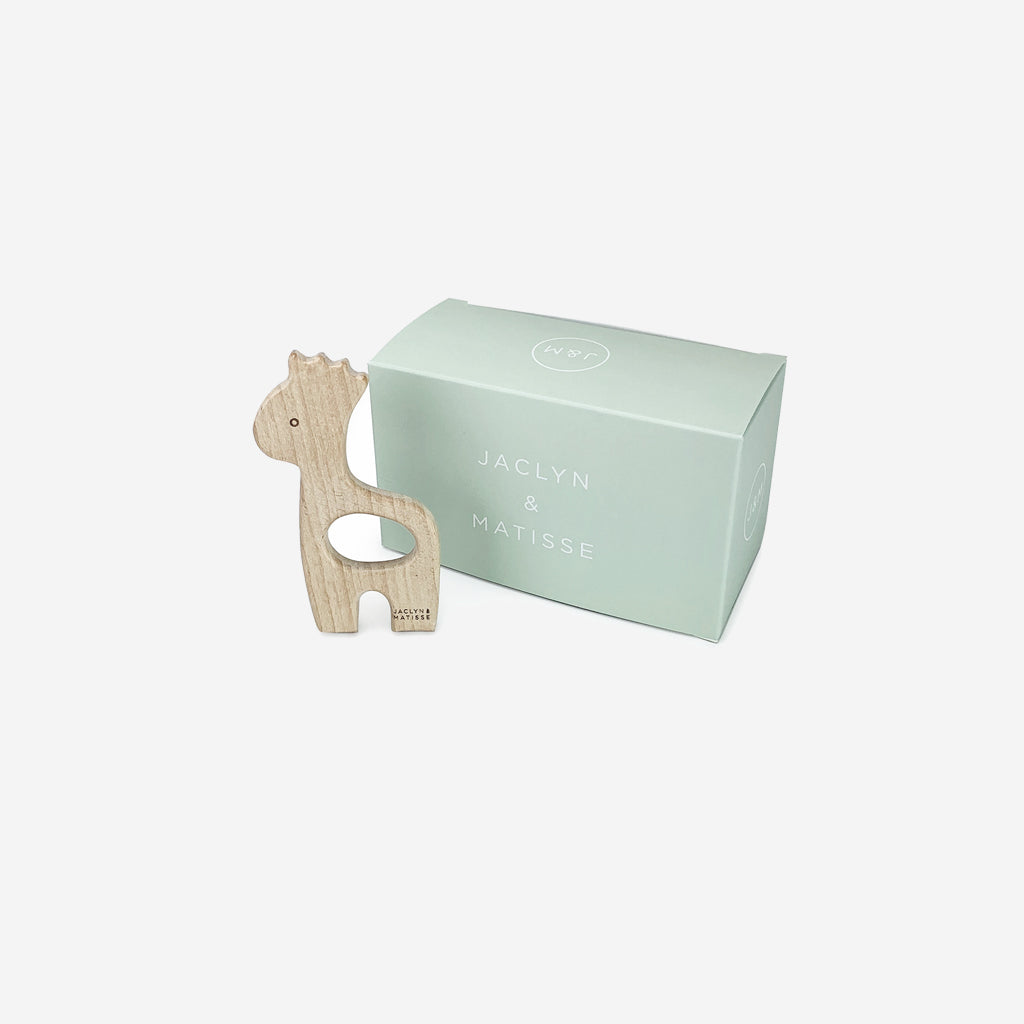 Georgie the Giraffe wooden teether beside its pale green gift box