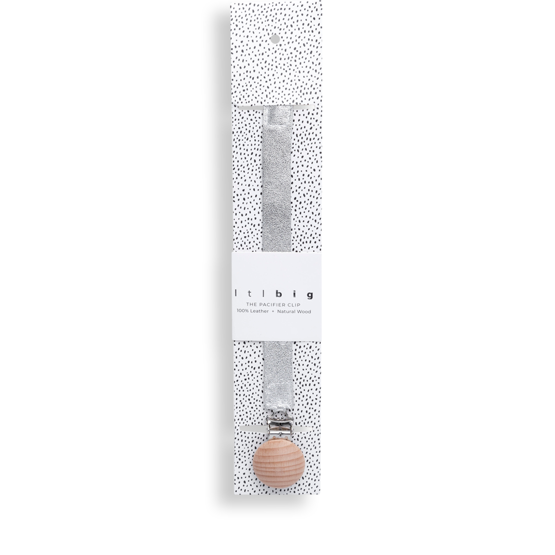 Paci Clip in Twinkle silver leather with a timber clip, in its speckled packaging