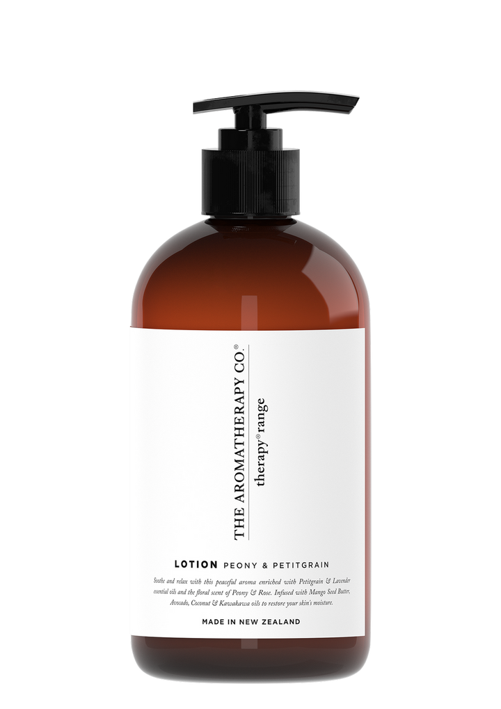 Therapy Soothe Peony & Petitgrain hand and body lotion in an amber pump bottle with a white label, on white