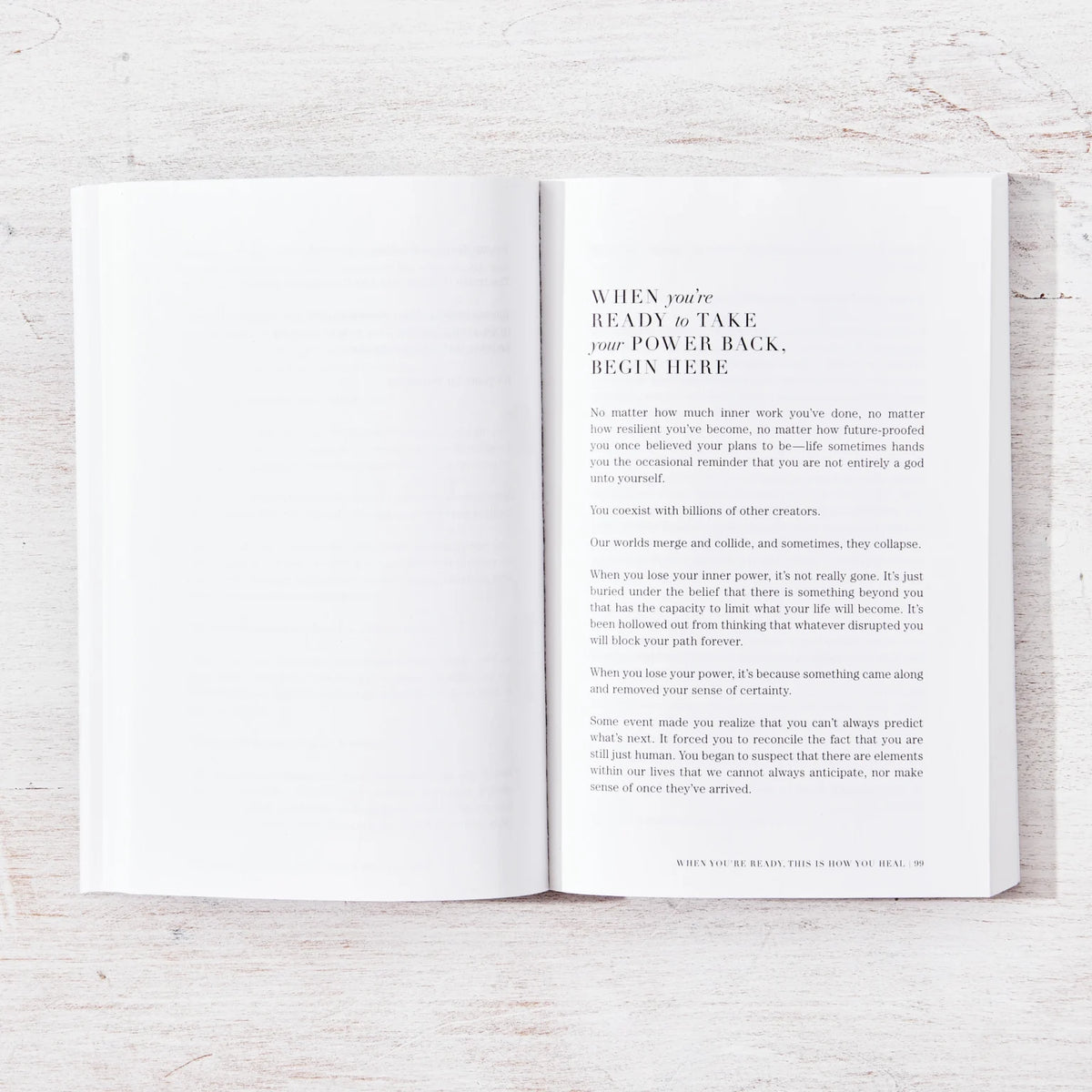 When You're Ready, This Is How You Heal open to two pages of text on a whitewashed timber table
