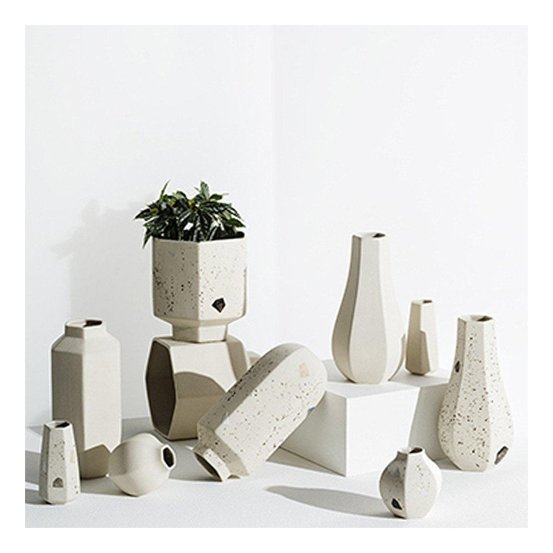 Carved natural pot styled with a faux plant
