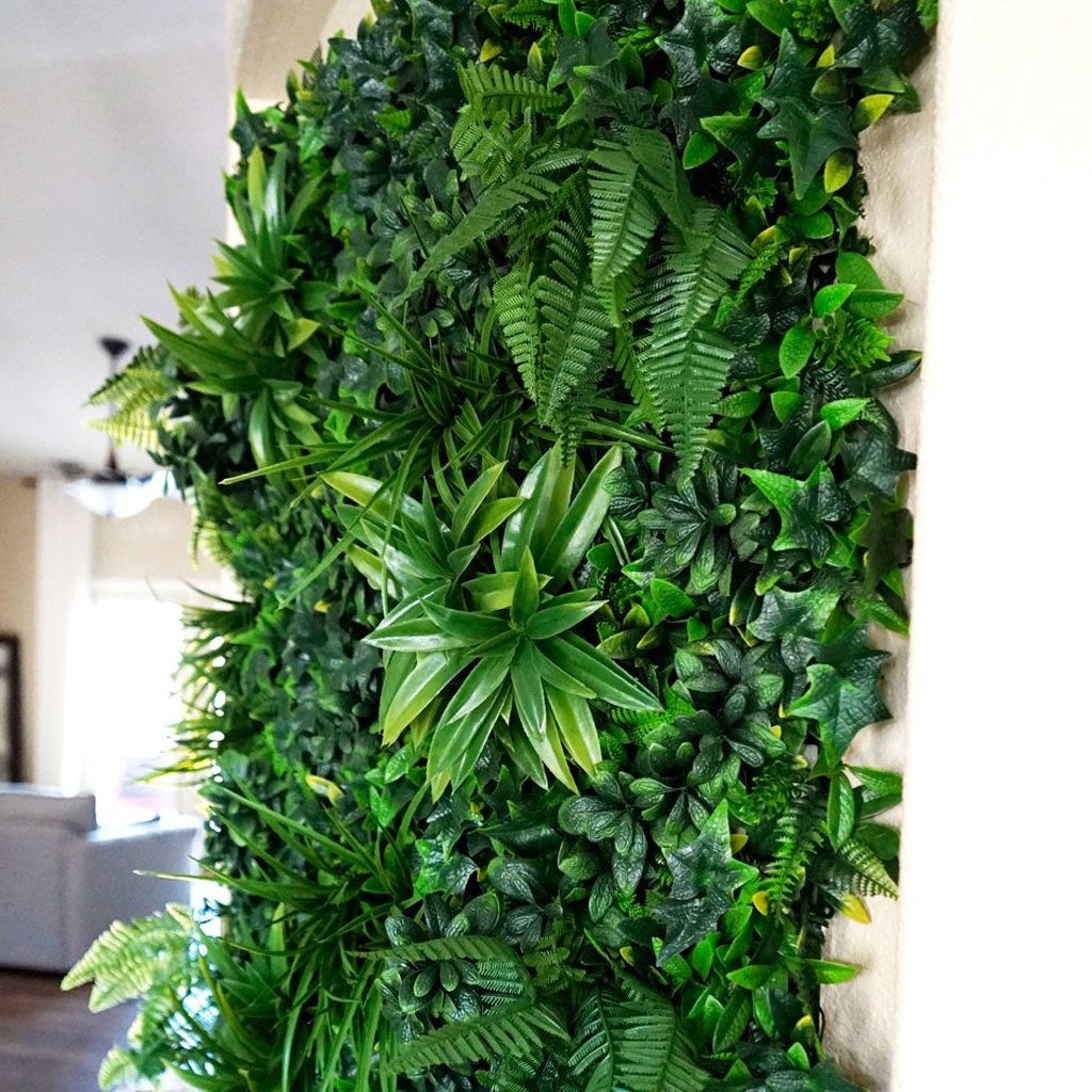 Artificial foliage panels joined together to create a full green wall